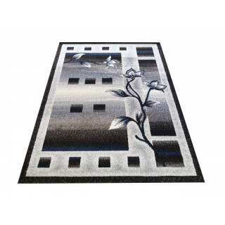 Moderný koberec so vzorom kvetov a štvorcov