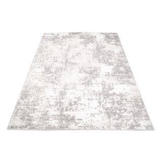 Vzorovaný koberec v jemných farbách