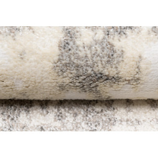 Vzorovaný koberec v jemných farbách