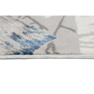 Koberec s modrým geometrickým vzorom