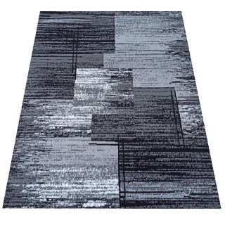 Sivý koberec s geometrickým vzorom