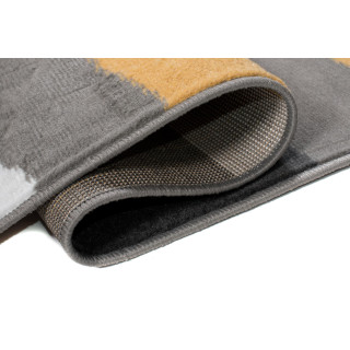 Moderný sivo-žltý koberec so vzorom