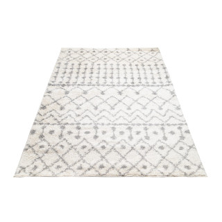 Chlpatý krémový koberec so vzormi