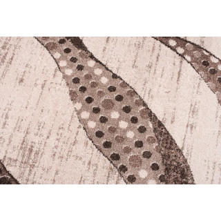 Koberec v béžovej farbe so vzorom