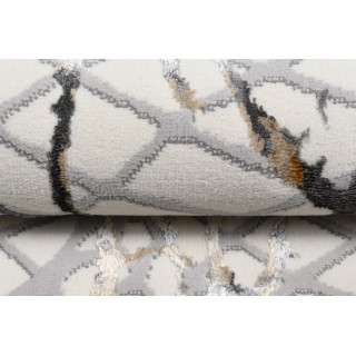 Vzorčasta preproga v krem barvi