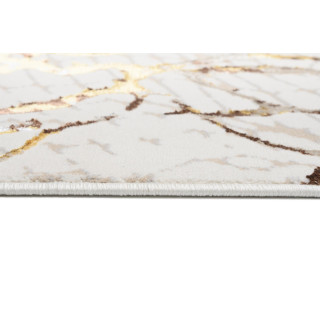 Krem preproga z zlatim vzorcem