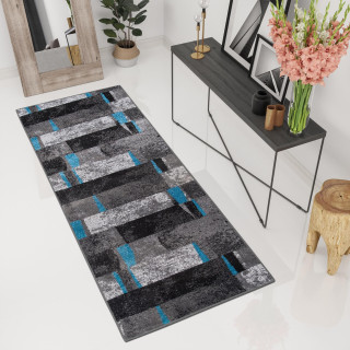 Moderný metrážny koberec sivej farby