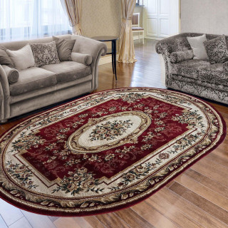 Oválny červený koberec so vzorom