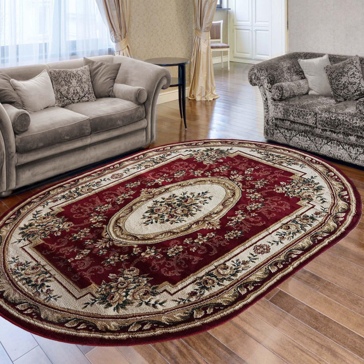 Oválny červený koberec so vzorom