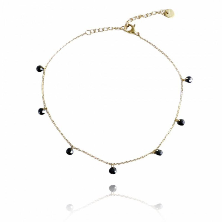 Pozlačena zapestnica s črnimi kamni
