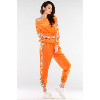 Oranžne ženske trenirke iz velurja s kontrastnimi trakovi
