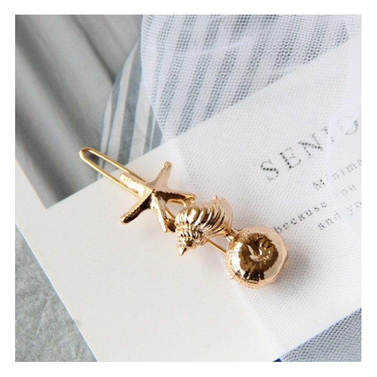 Sponka za lase z morskimi okraski v zlati barvi