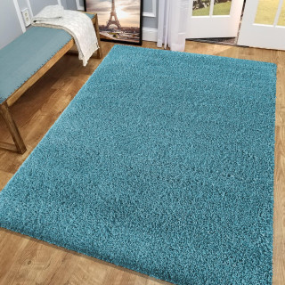 Dlakava preproga v turkizni barvi