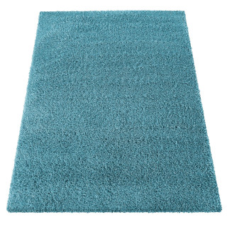 Dlakava preproga v turkizni barvi