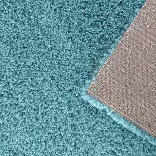 Dlakava preproga v turkizni barvi