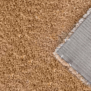 Dlakava preproga v barvi gorčice