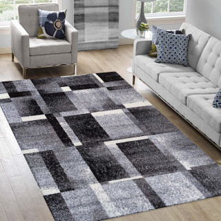 Preproga z geometrijskim vzorcem v sivi barvi