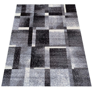 Preproga z geometrijskim vzorcem v sivi barvi