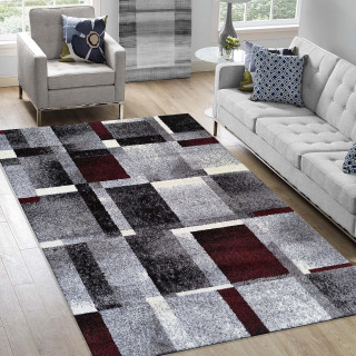 Preproga z geometrijskim vzorcem v rdeči barvi