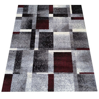 Preproga z geometrijskim vzorcem v rdeči barvi