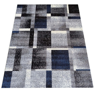 Preproga z geometrijskim vzorcem v modri barvi