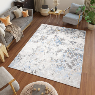 Moderna preproga z belim in modrim vzorcem