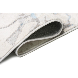 Bela preproga z vzorcem modrega marmorja