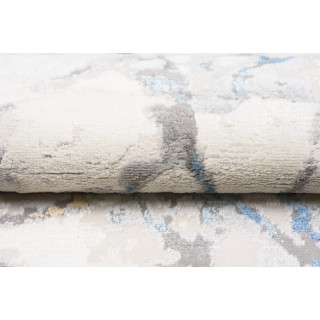 Bela preproga z vzorcem modrega marmorja