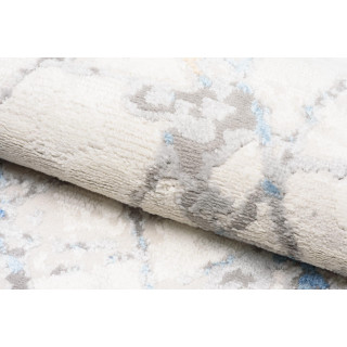 Bela preproga z vzorcem modrega marmorja