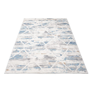 Moderna vzorčasta preproga v beli in modri barvi