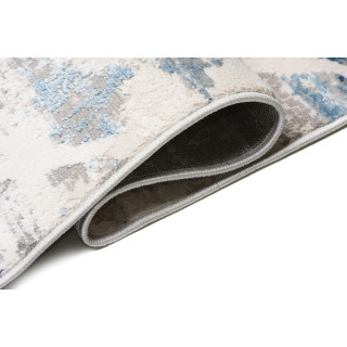 Moderna vzorčasta preproga v beli in modri barvi