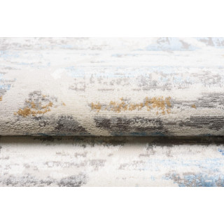 Moderna vzorčasta preproga v beli in modri barvi