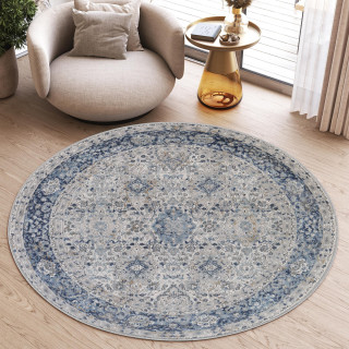 Vzorčasta okrogla preproga v beli in modri barvi