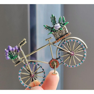 Okrasna broška s pisanim kolesom