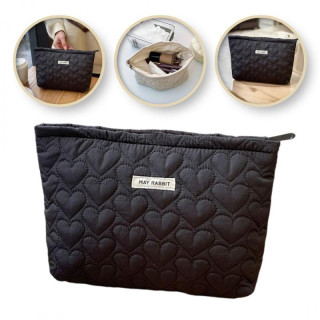 Prešita kozmetična torbica v črni barvi