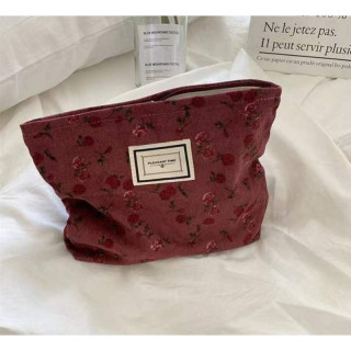 Bordo kozmetična torbica z rožicami