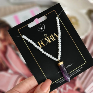 Pozlačena ogrlica z vijoličnim kristalom