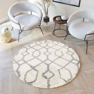 Okrogla kosmata preproga v bež barvi