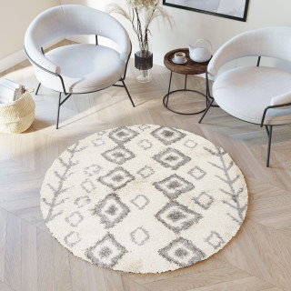 Okrogla vzorčasta preproga v bež barvi