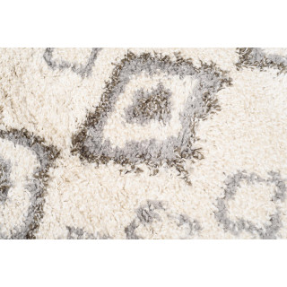 Okrogla vzorčasta preproga v bež barvi