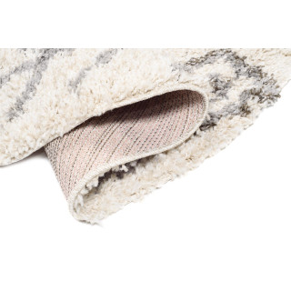 Okrogla vzorčasta preproga v bež barvi