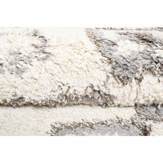 Okrogla vzorčasta preproga v bež barvi