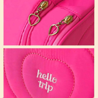 Prešita roza kozmetična torbica z ročajem