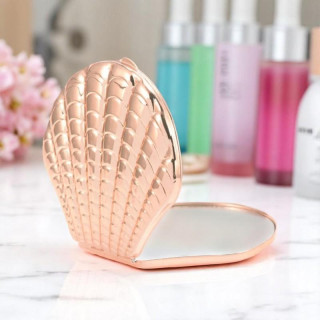 Odprto kovinsko ogledalo v obliki školjke