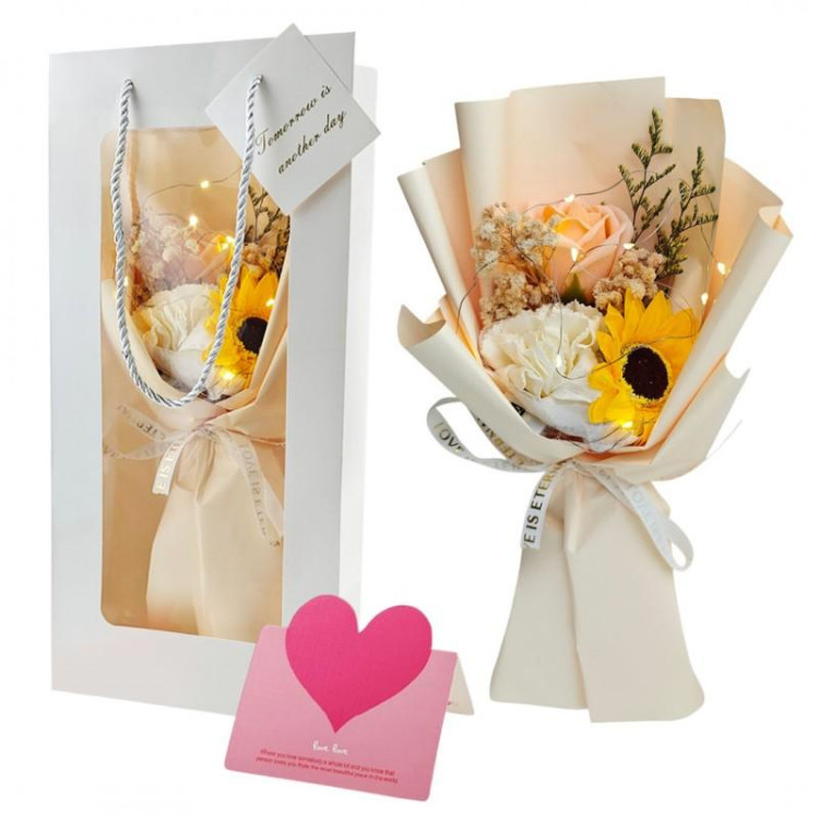 Šopek rumenih milnih rož v škatli z LED osvetlitvijo