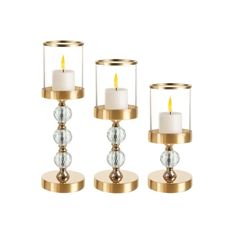 Komplet treh steklenih svečnikov v zlati barvi
