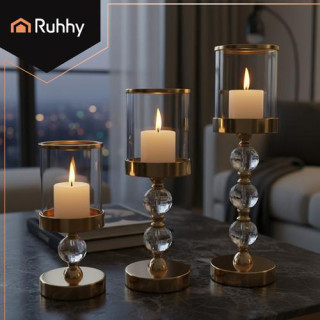 Komplet treh steklenih svečnikov v zlati barvi