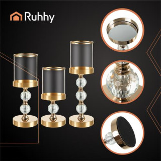 Komplet treh steklenih svečnikov v zlati barvi