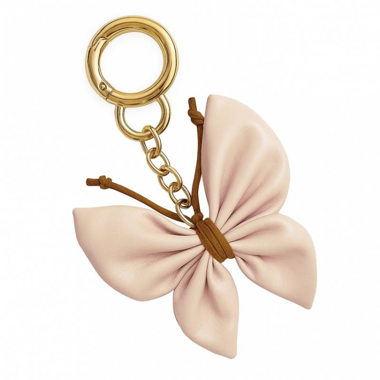 Usnjen obesek s kremnim metuljem