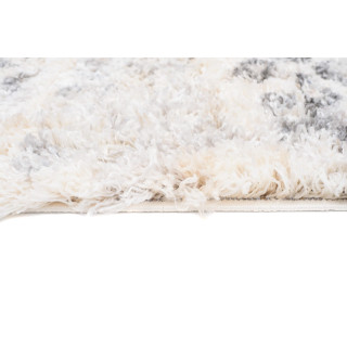 Kremno obarvana kosmata preproga z resicami